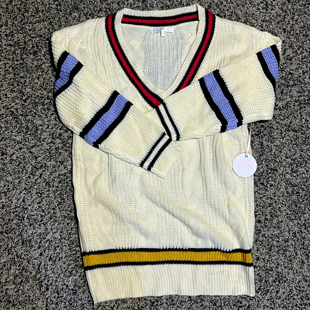 Woman’s More To Come v-neck knit sweater. Size M. With striped pattern.